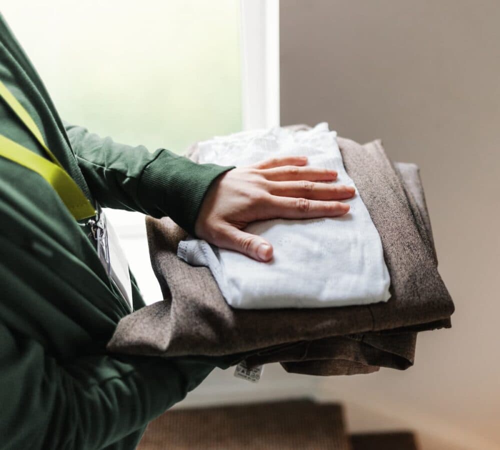 A pile of folded clothes in different colors