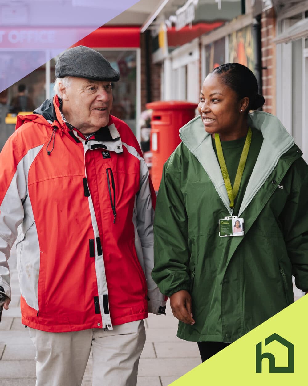 An elderly man and a care worker walk together outside a shop, smiling and talking. - Home Instead