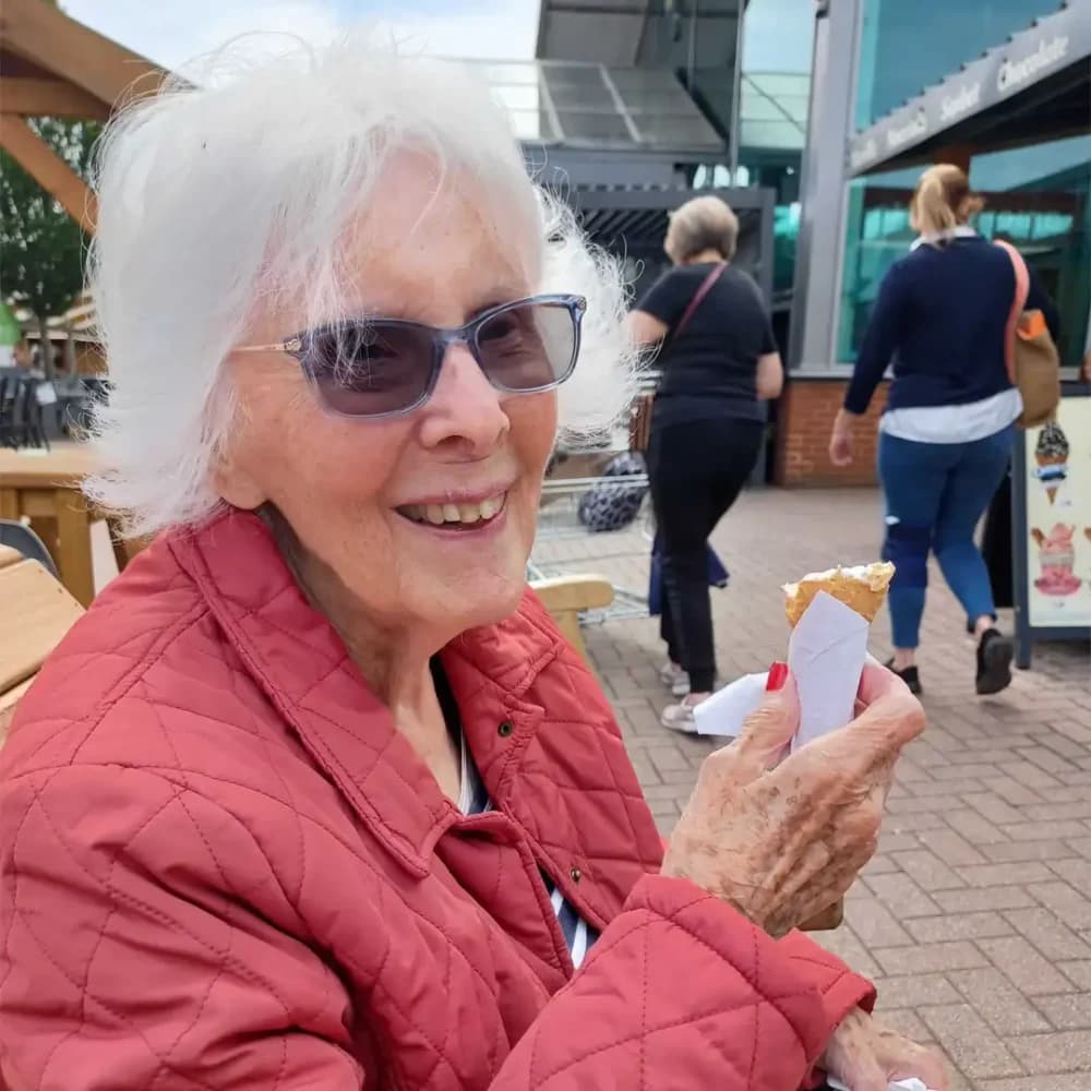 Home Instead Ascot client Ann enjoying an ice cream