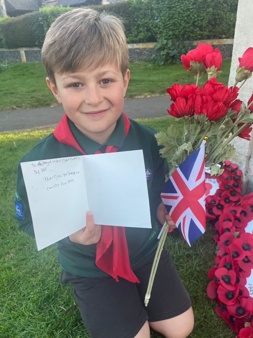 “Vintage photo of World War II soldiers or symbolic red poppy wreaths honoring fallen heroes.