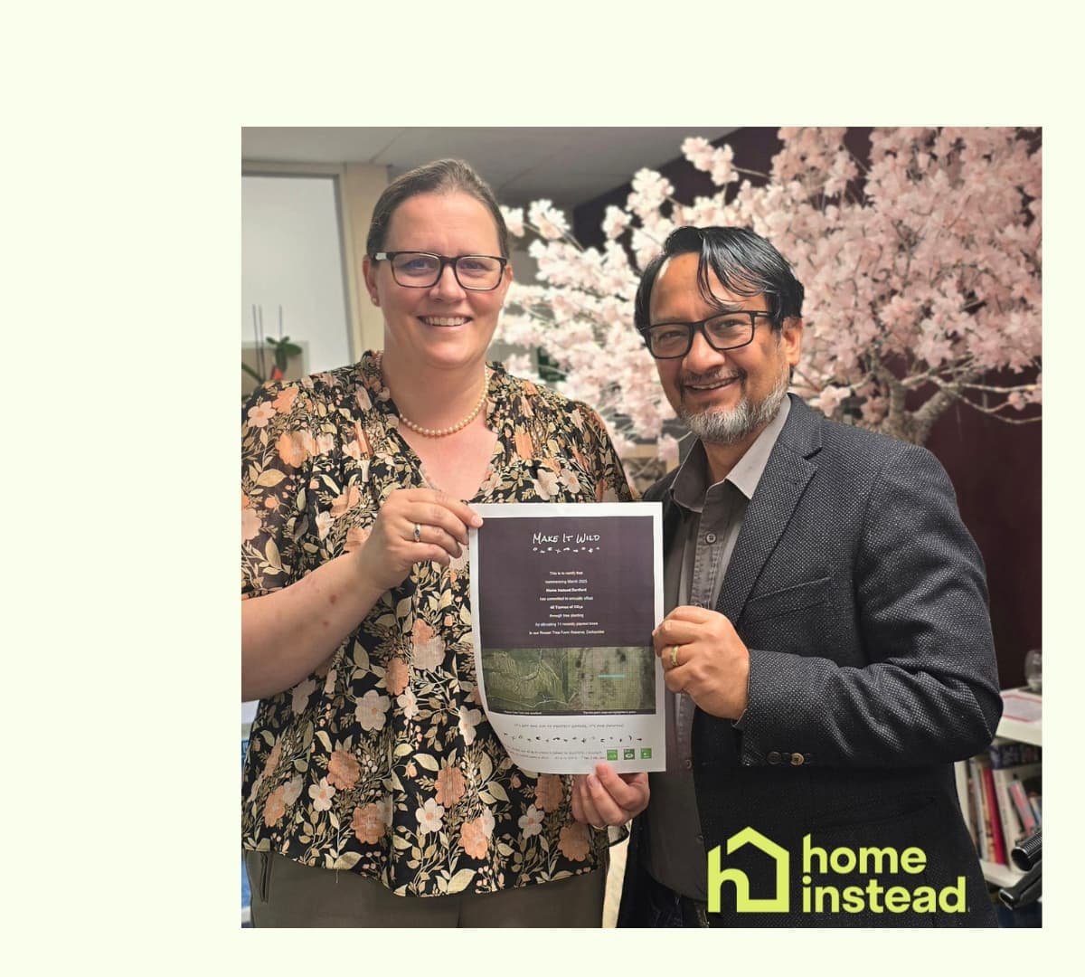 A male and female both happy and smiling while holding a certificate