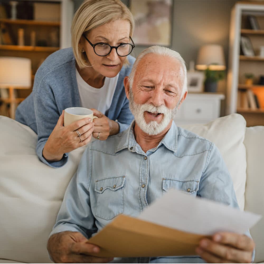 Elderly couple reviewing paperwork