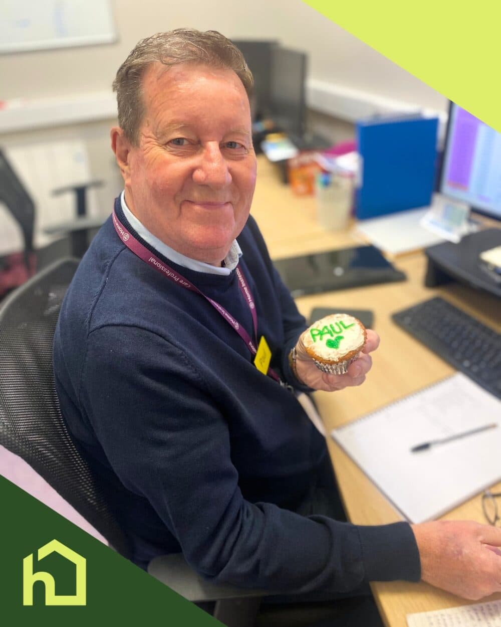 Reception and office administrator Paul holding cupcake with his name on it