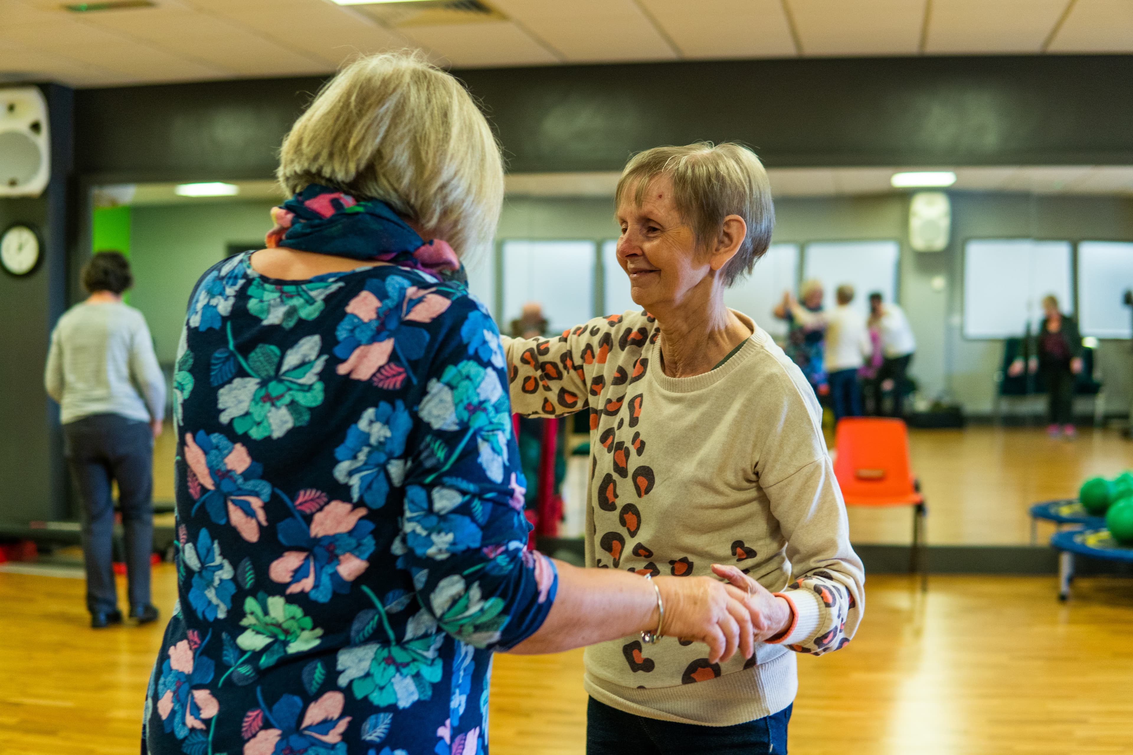 Two people dancing in a dancing class