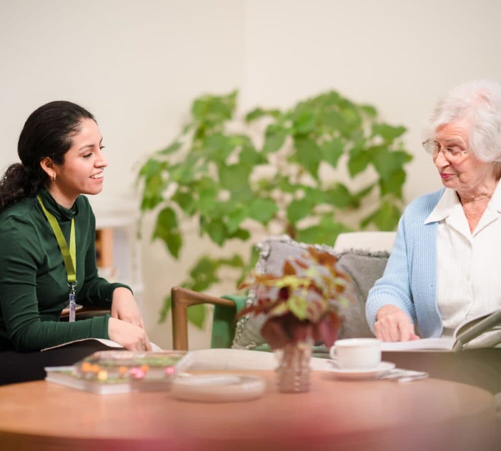Chatting together inside the house while having a cup of tea