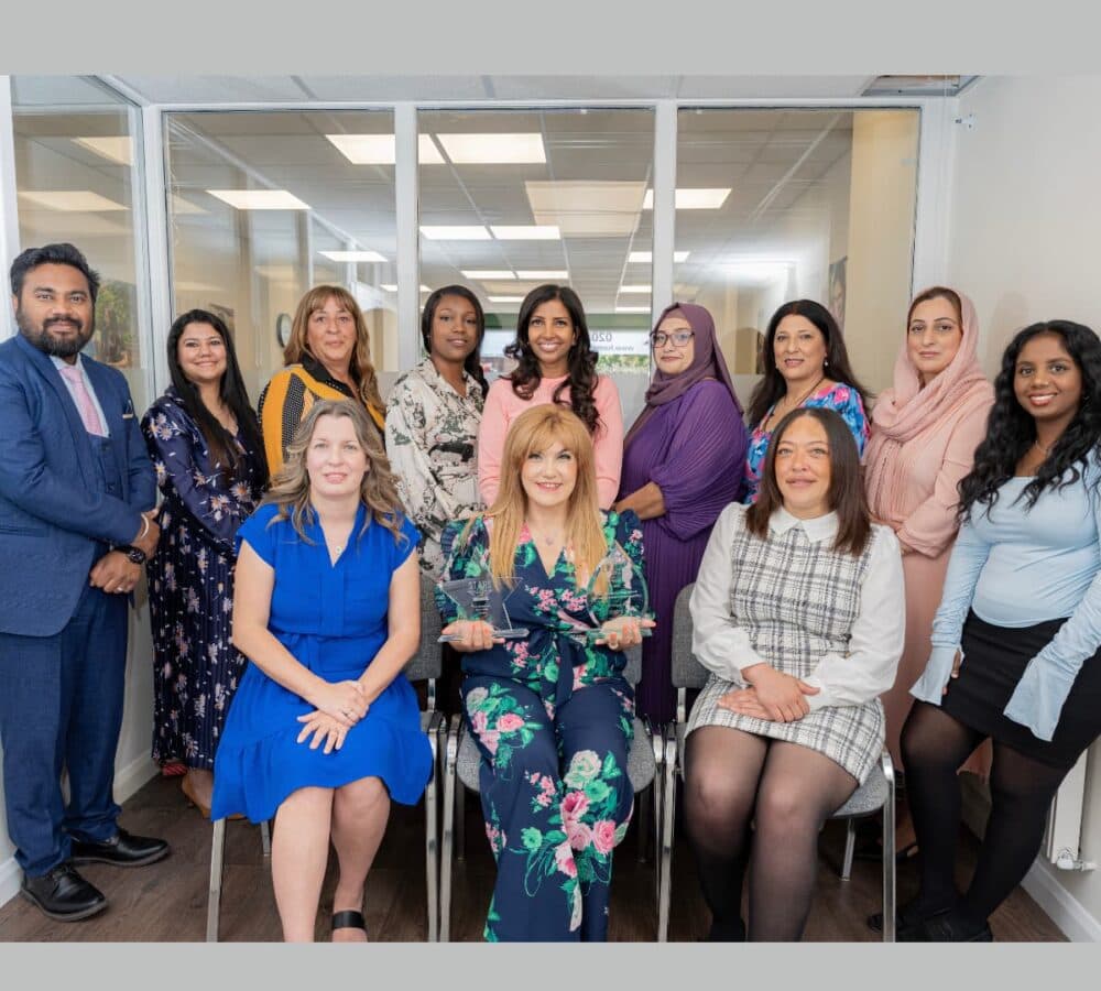Group of women all happy and smiling inside the office