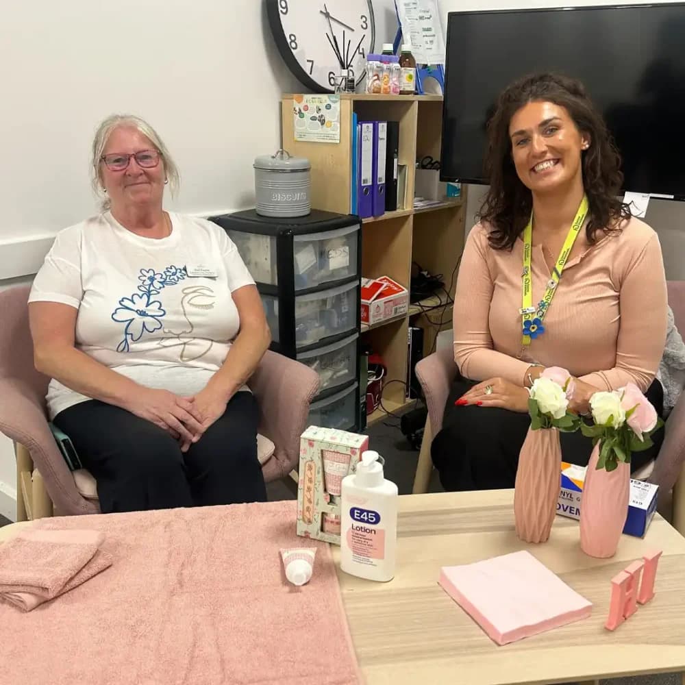 Home Instead Watford team sitting at the nail care pampering area in the Memory Cafe