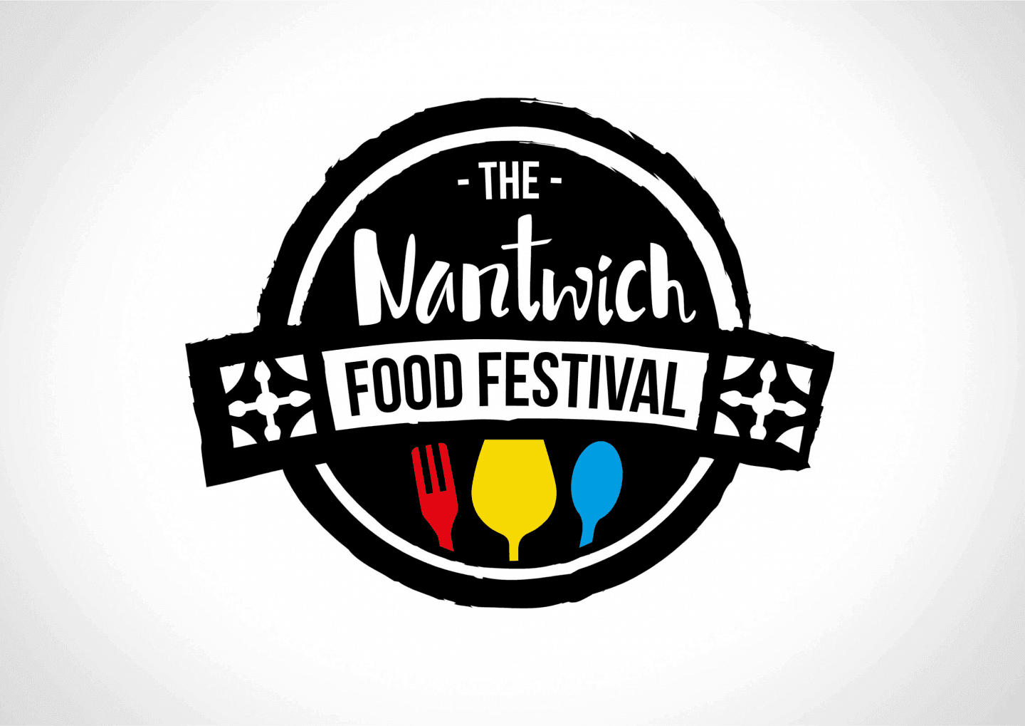 Logo for The Nantwich Food Festival with a red fork, yellow glass, and blue spoon below the text. - Home Instead