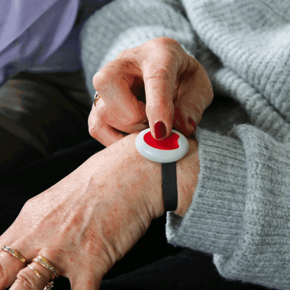 telecare device on an elderly ladies wrist
