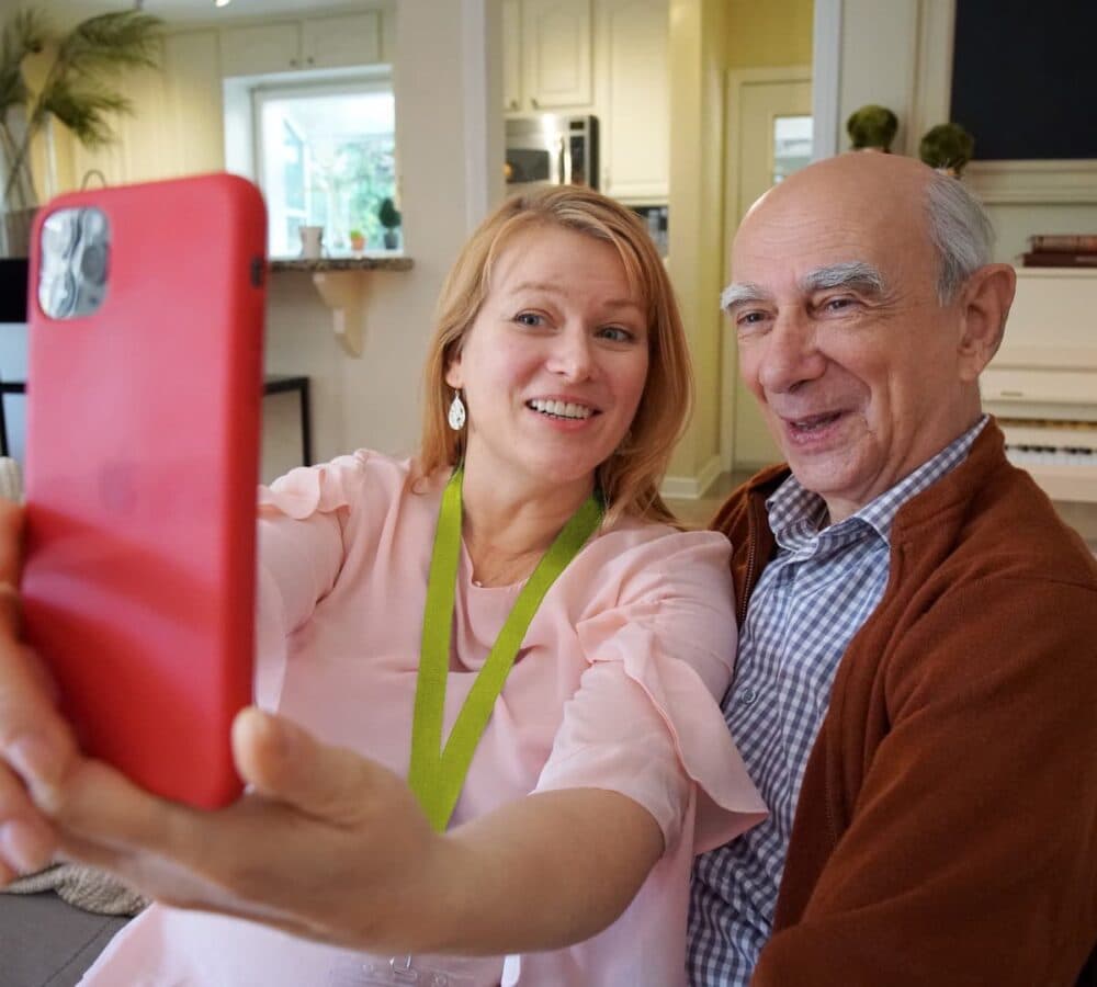 Two people having a selfie inside the house