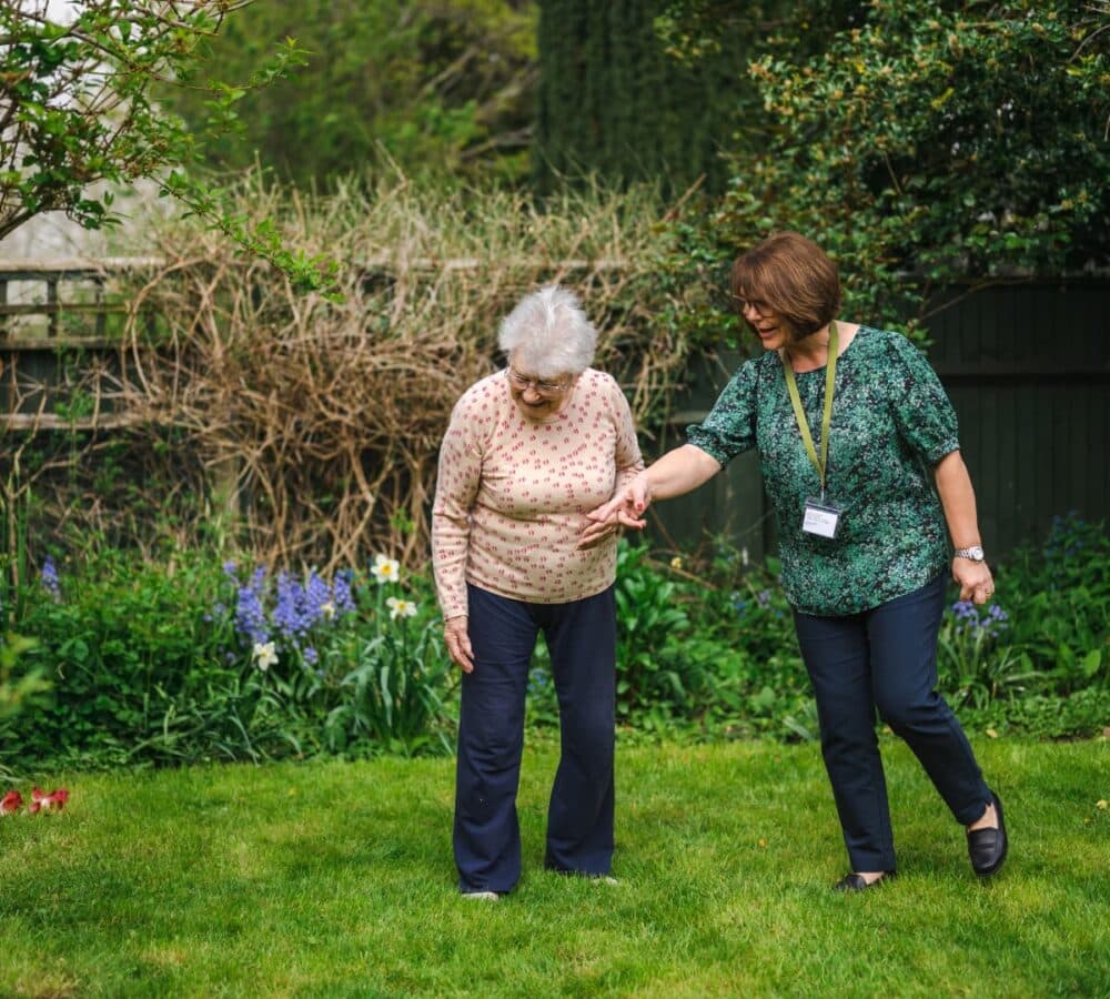 Two women walking in the garden