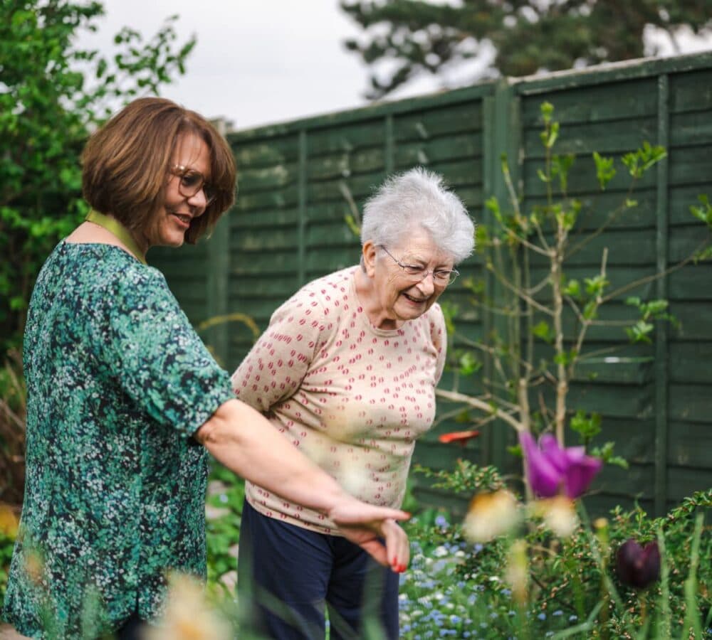 Two women walking in the garden