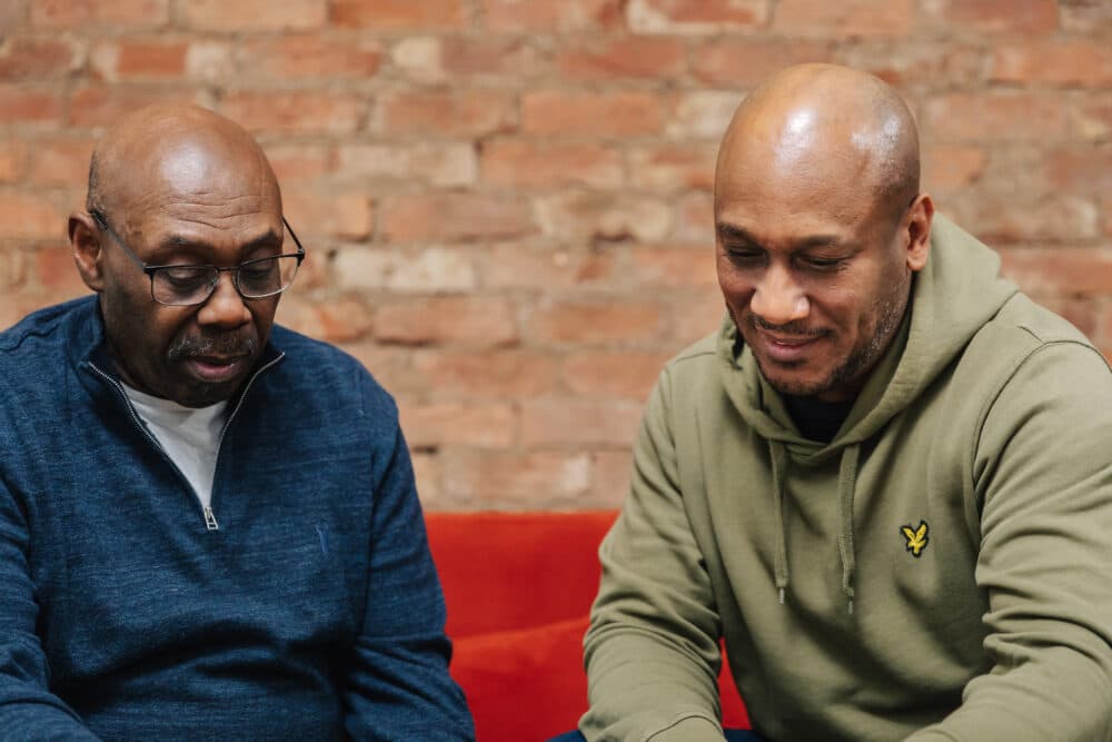 Dementia father son chatting - Home Instead