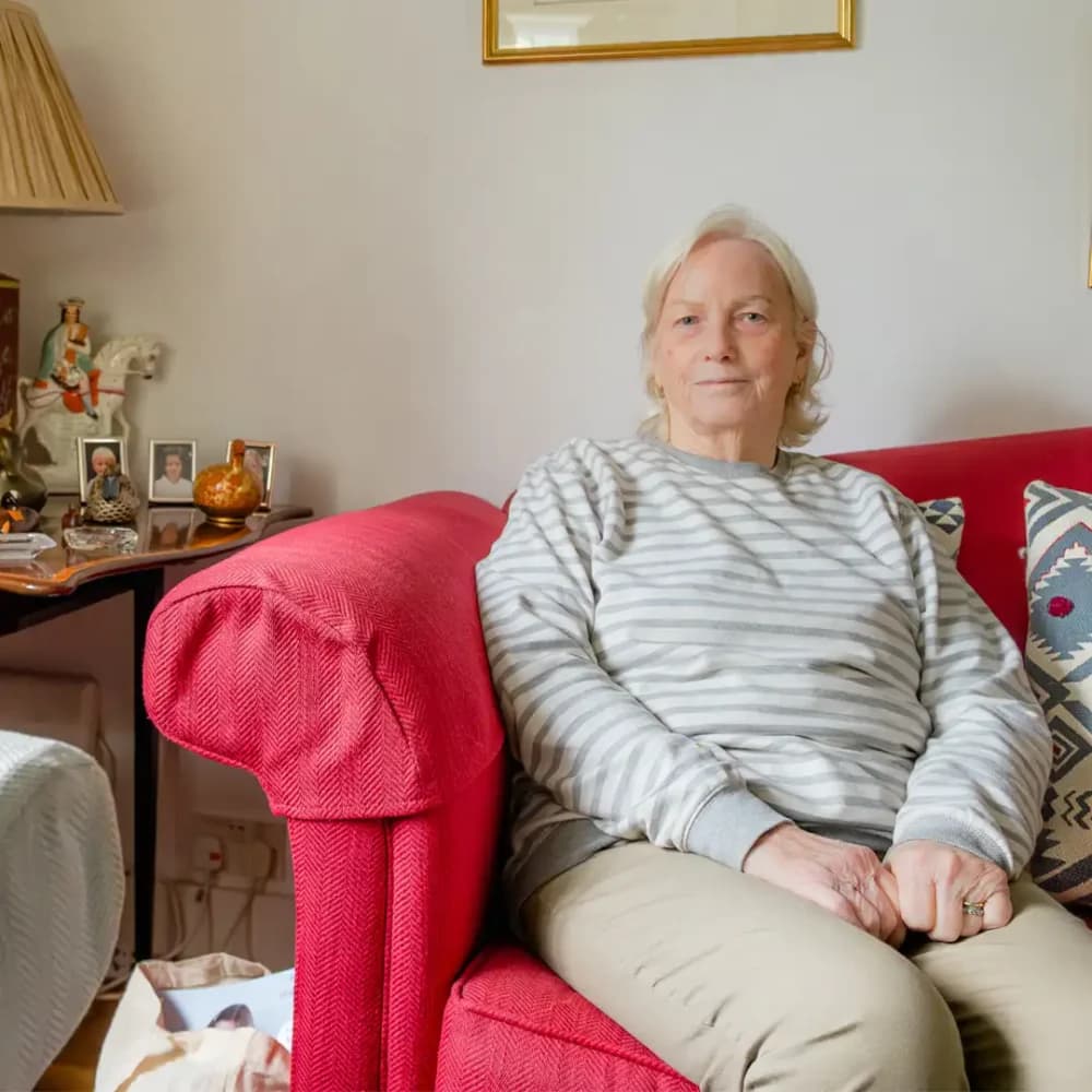 Home Instead Farnborough client Vivian sitting comfortably at home