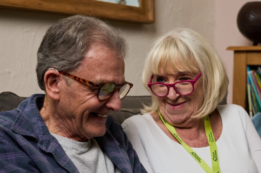 Home Instead carer providing companionship support to an elderly man