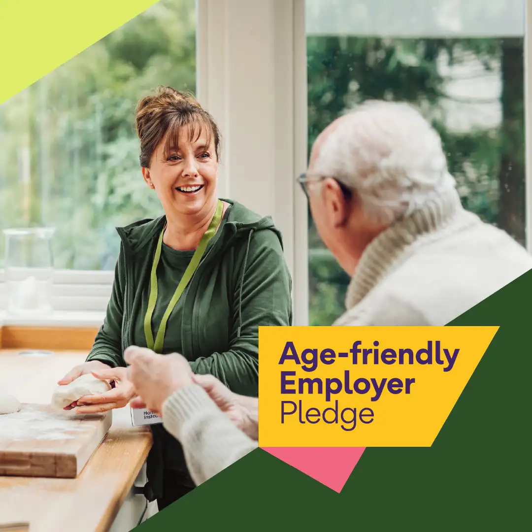 Age friendly employer badge logo displayed over an image of a Home Instead Watford care professional with her client.