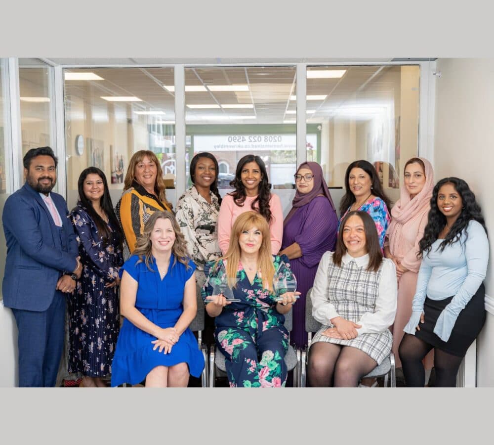 Group of men and women slining inside the office Home Instead