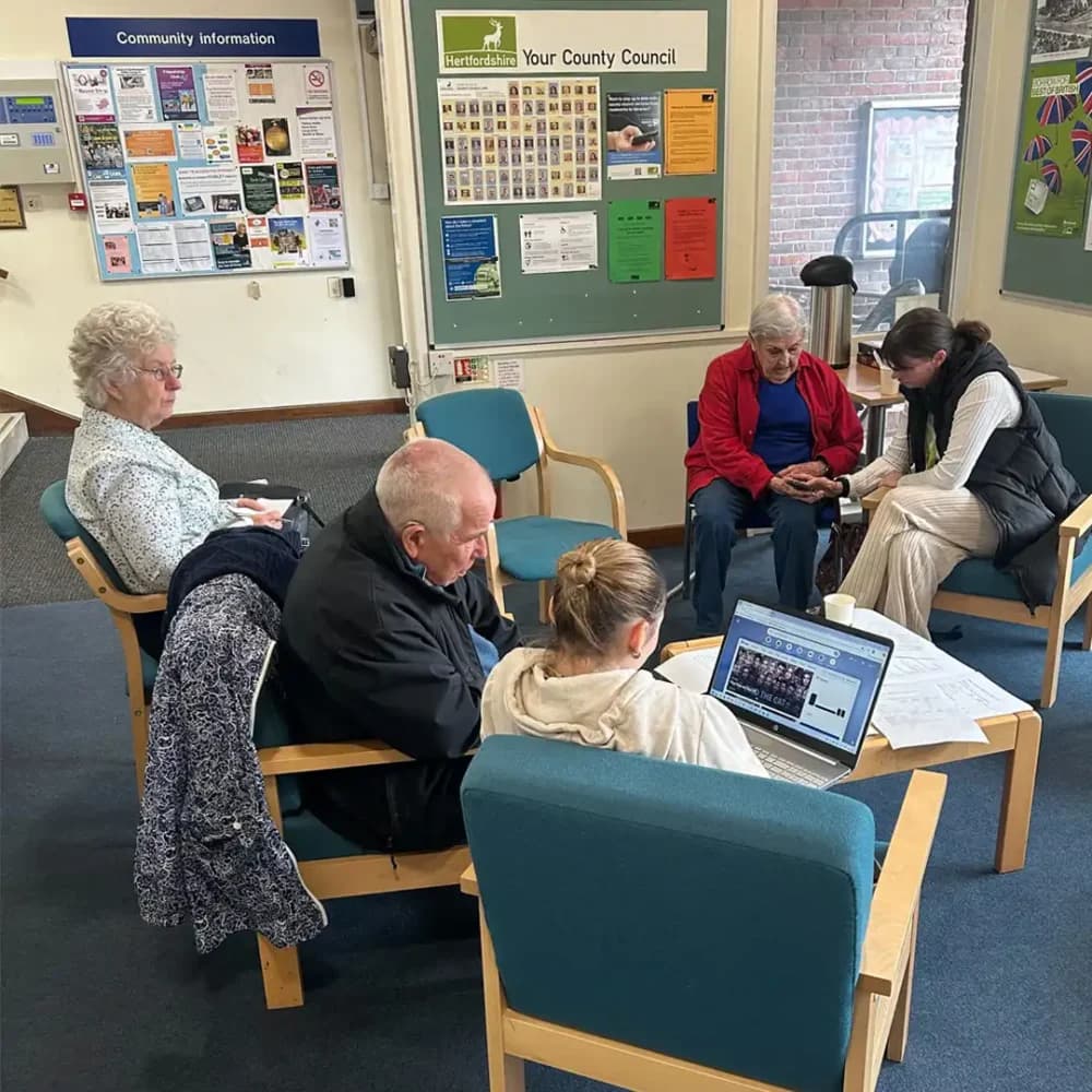 Volunteers supporting older people at the Home Instead Community Tech Cafe