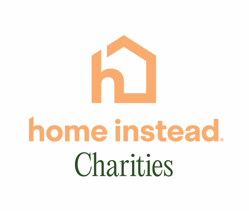 Logo with an orange house icon and text: "home instead Charities" on a white background. - Home Instead