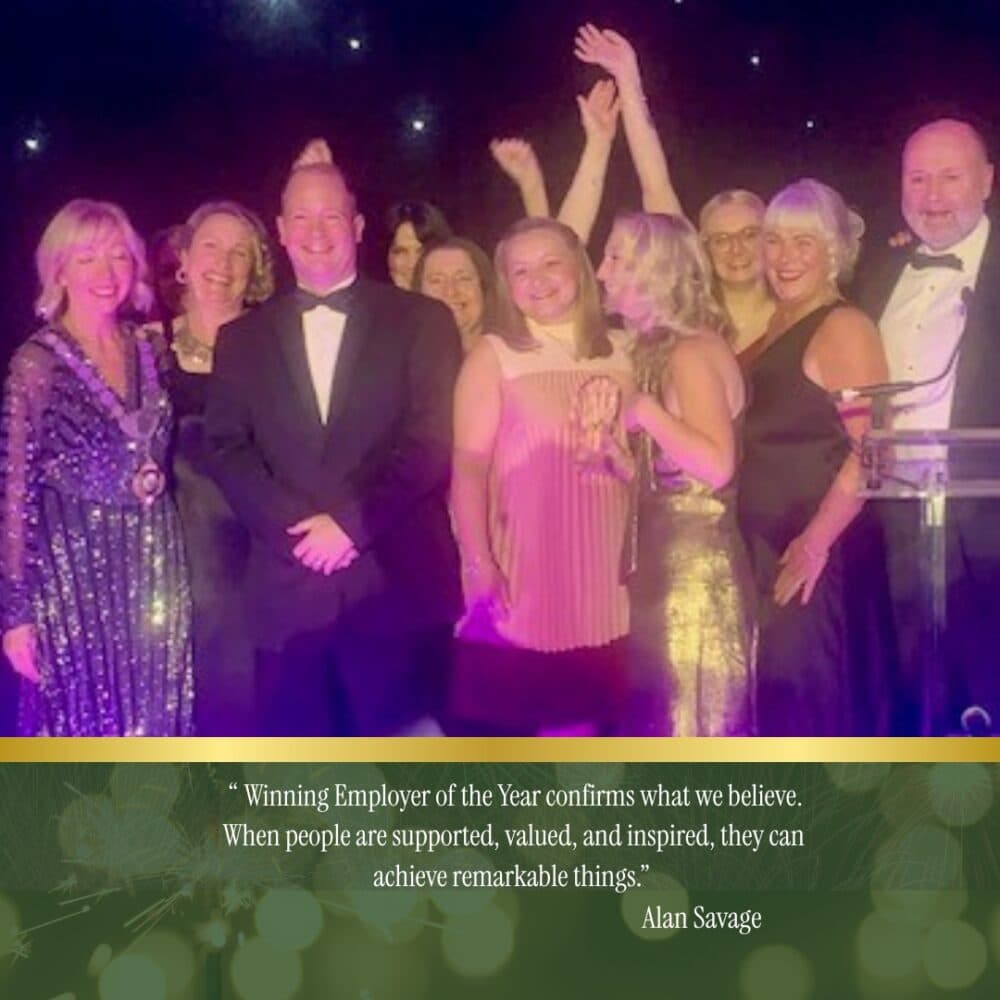 Home instead winning Employer of the year 2025 team on stage