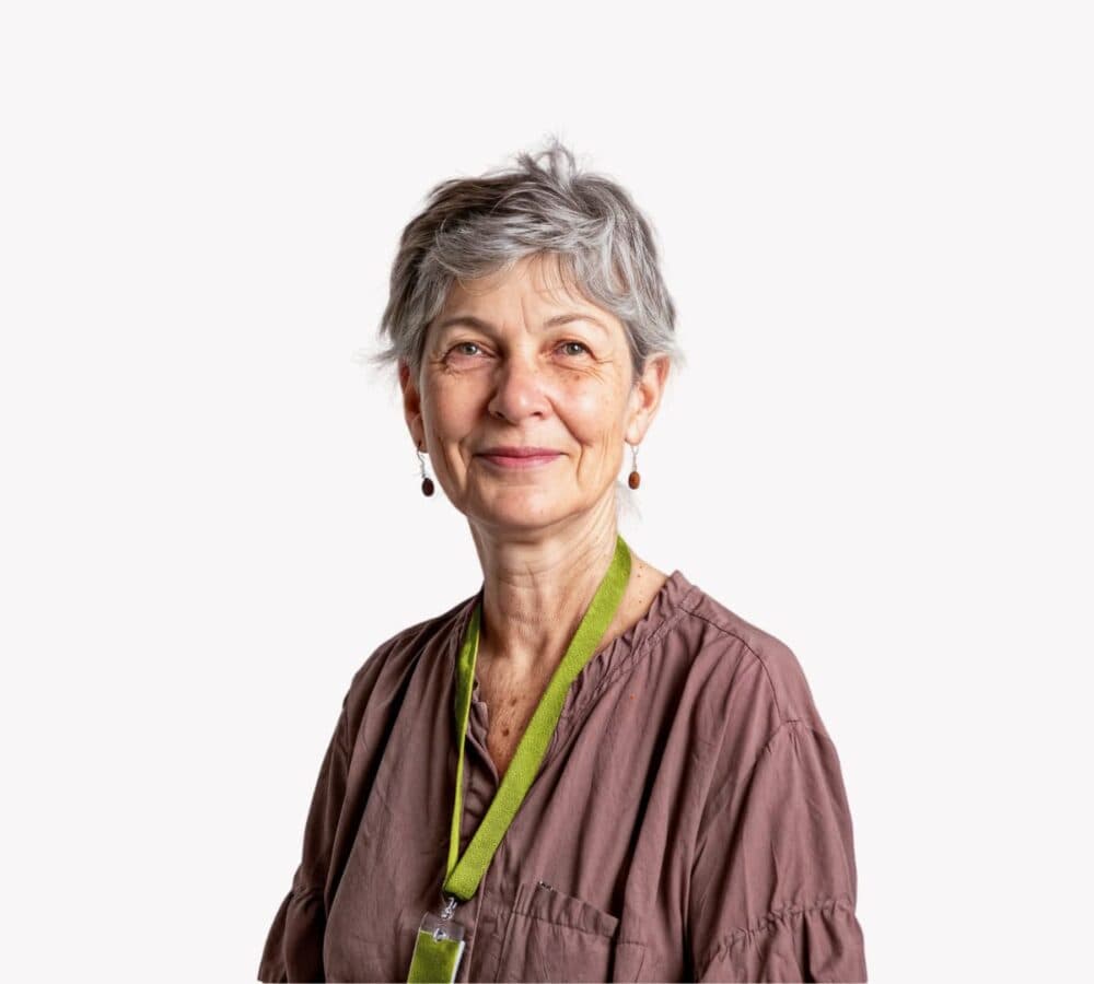 An older female adult with grey hair happy and smiling