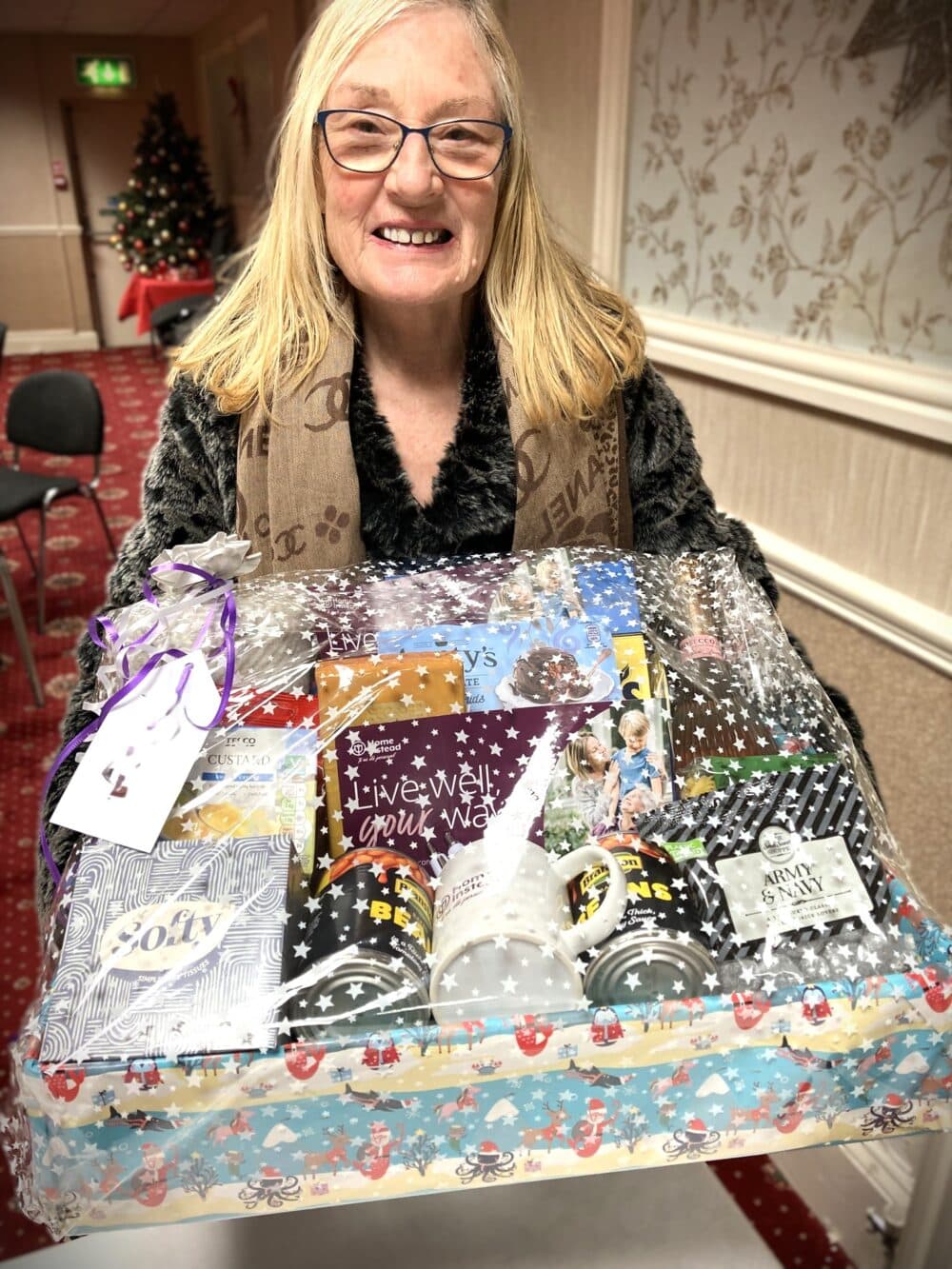 Woman carrying box of gifts