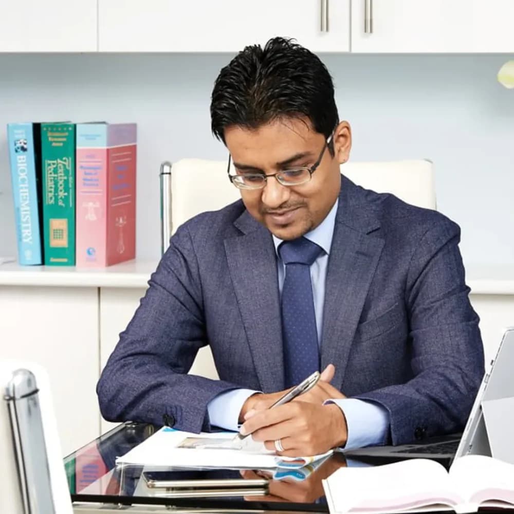 Dr Suhail Hussain working at his desk