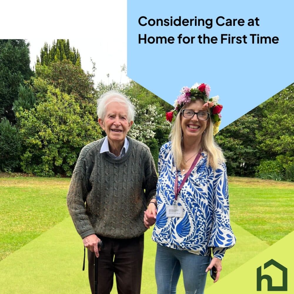 Smiling elderly man with walking stick stands beside caregiver in garden, with text about care at home. - Home Instead