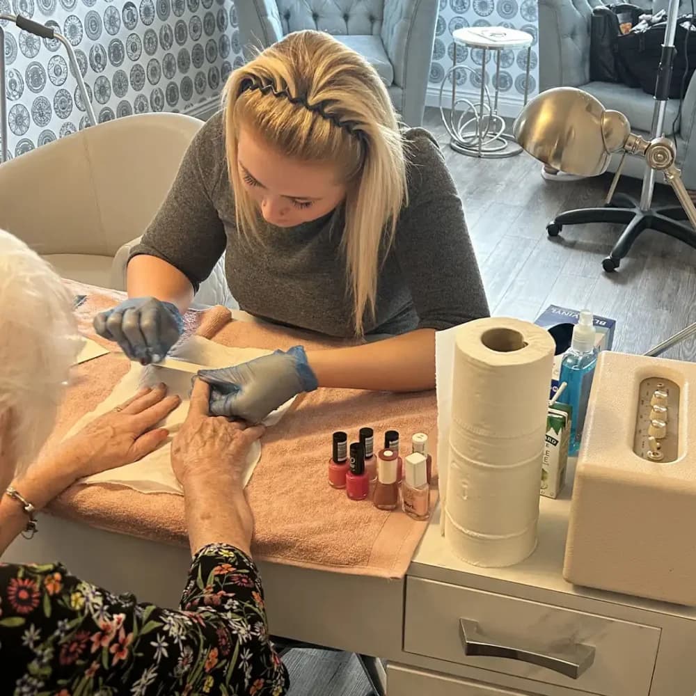 Home Instead Watfords' Grace doing a nail care pamper session at Carpenders Park Care Home
