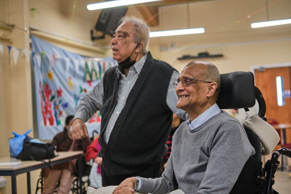 older man with a mask and older man in wheelchair - Home Instead