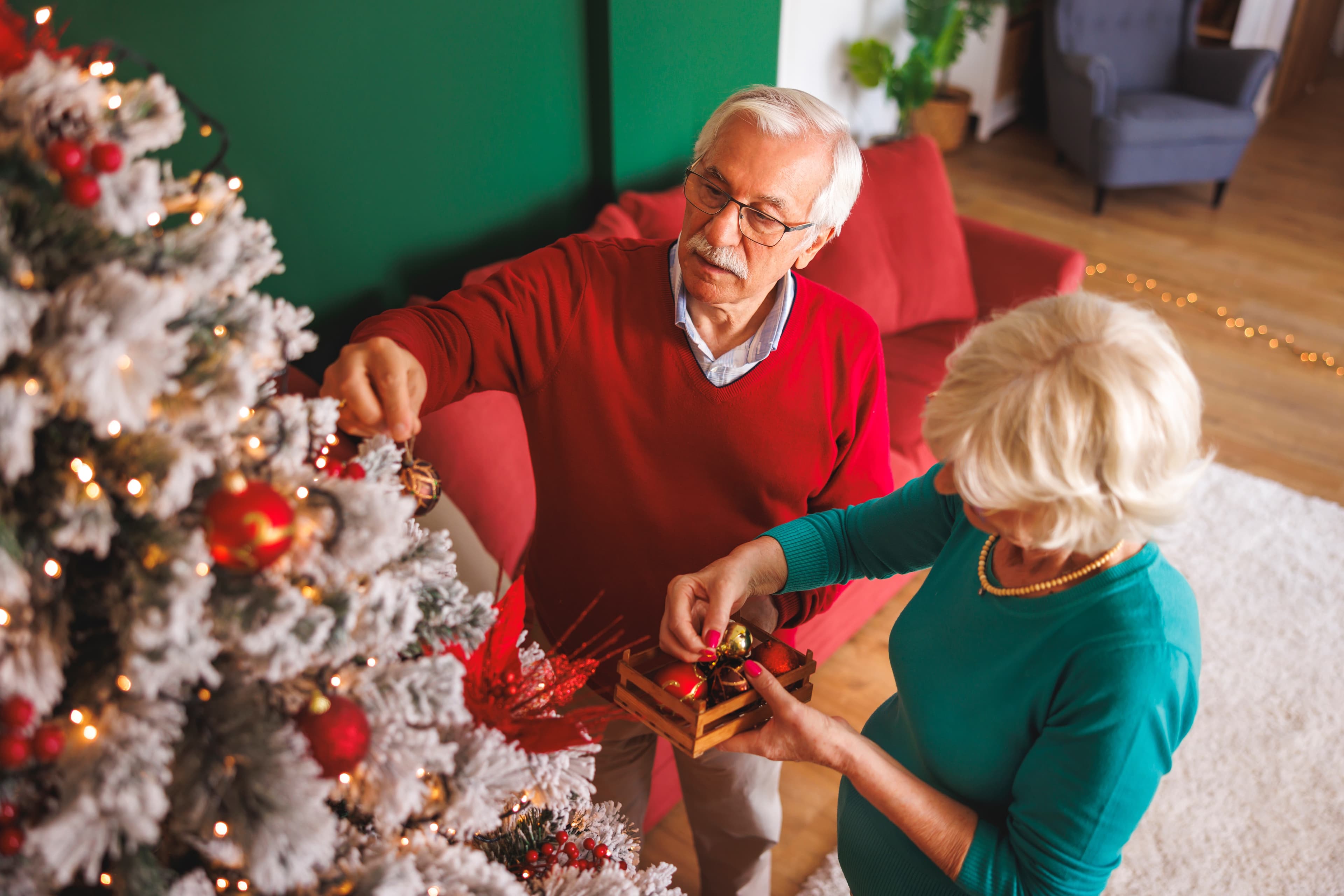 Elderly dementia couple decorate their Christmas Tree