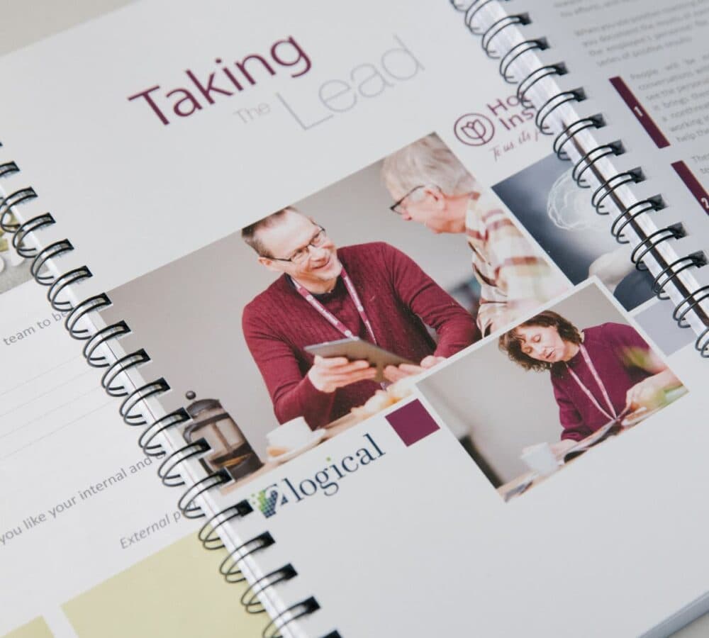A training manual for carers at Home Instead with two men on the cover
