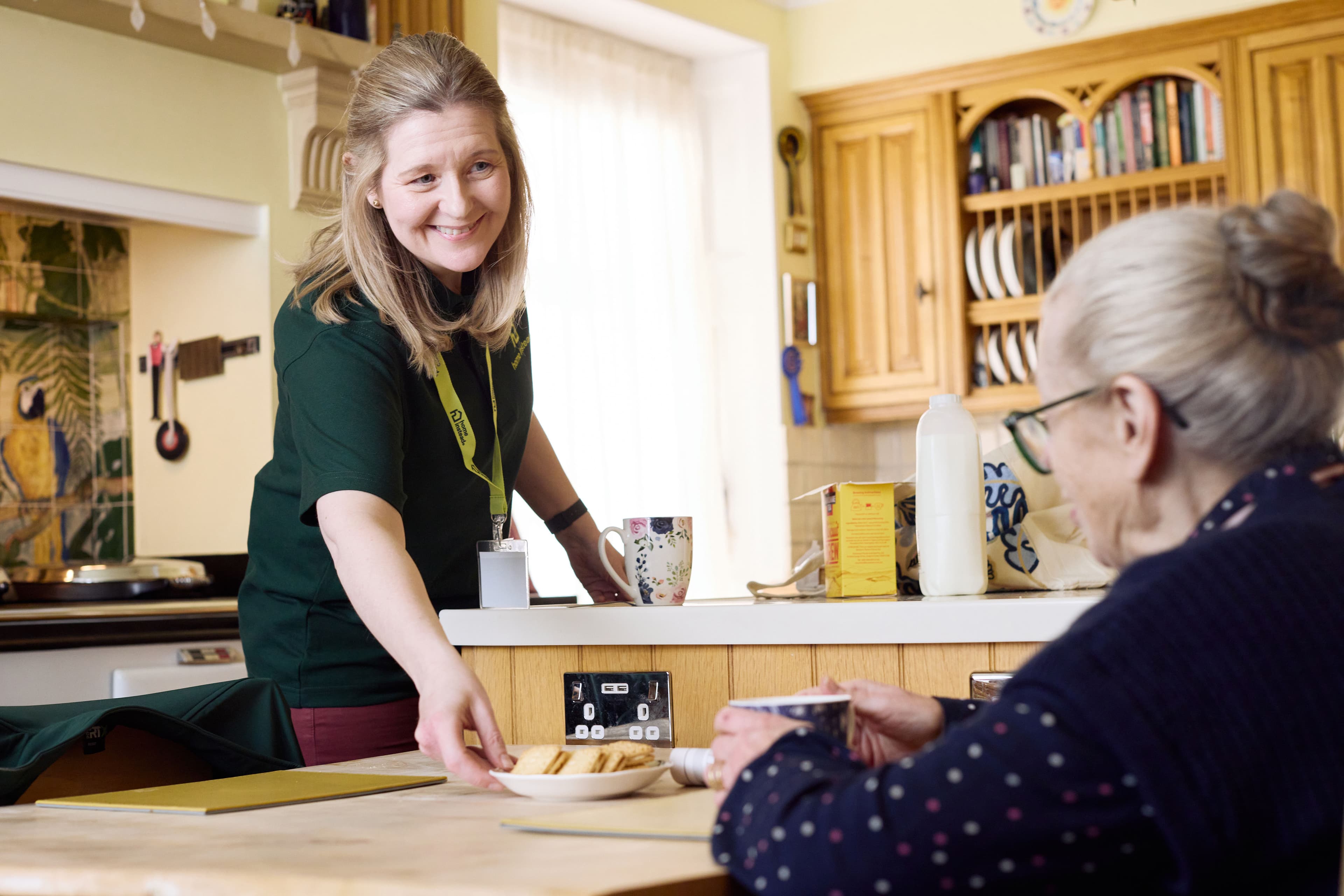 Live-in carer providing support to an elderly woman in her own home