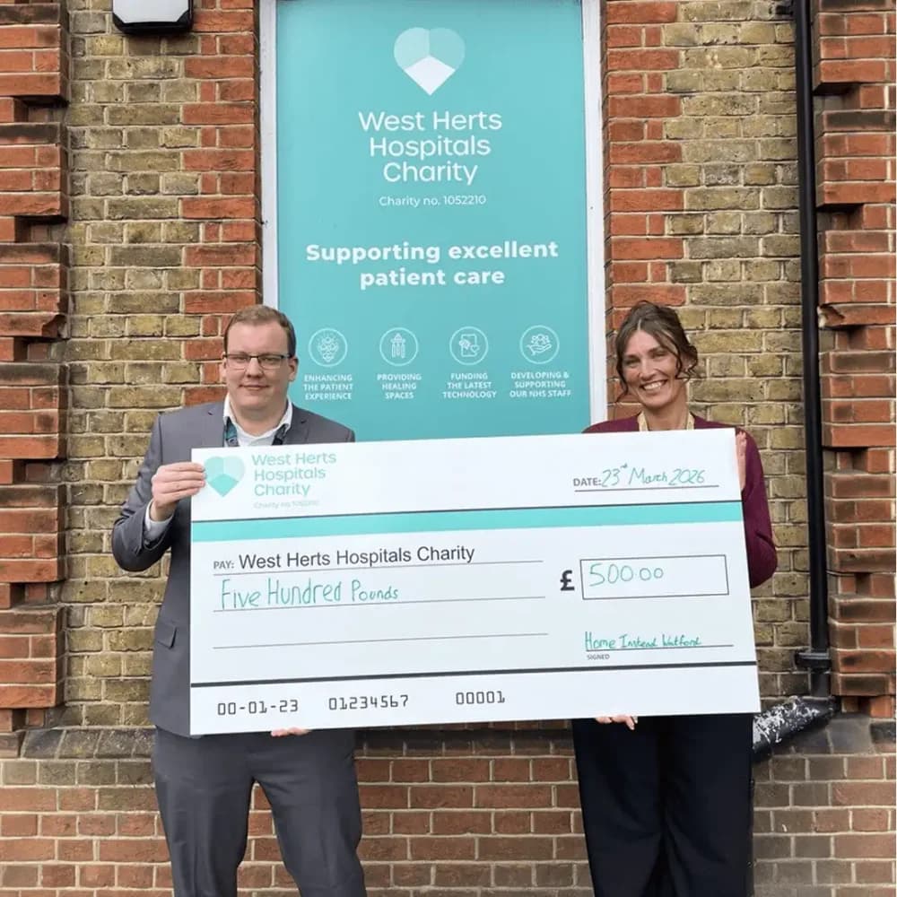 Home Instead Watford Group Business Development Manager Stephanie Turner presenting donation to Watford General Hospital