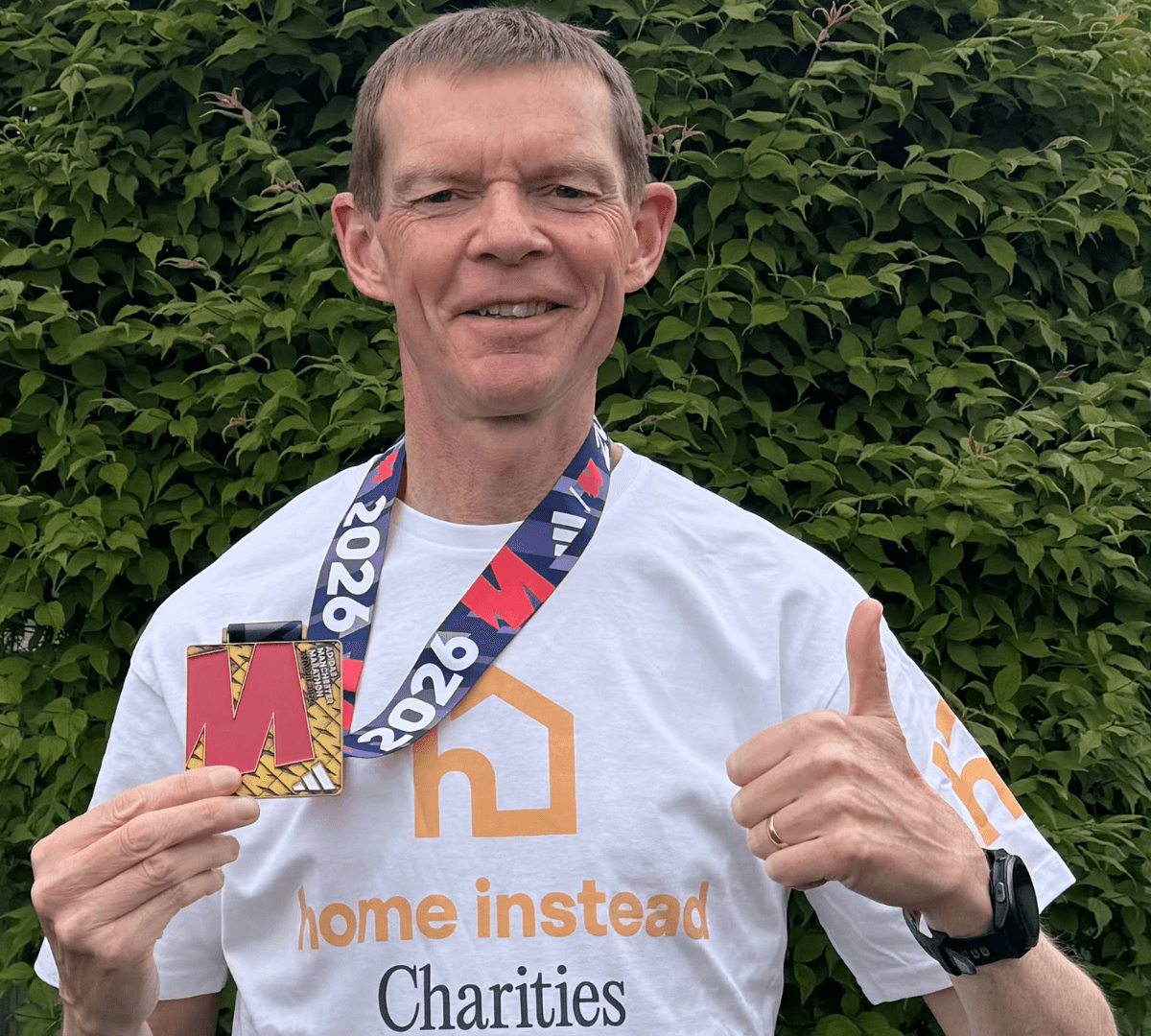Image of Chris Carter holding a medal