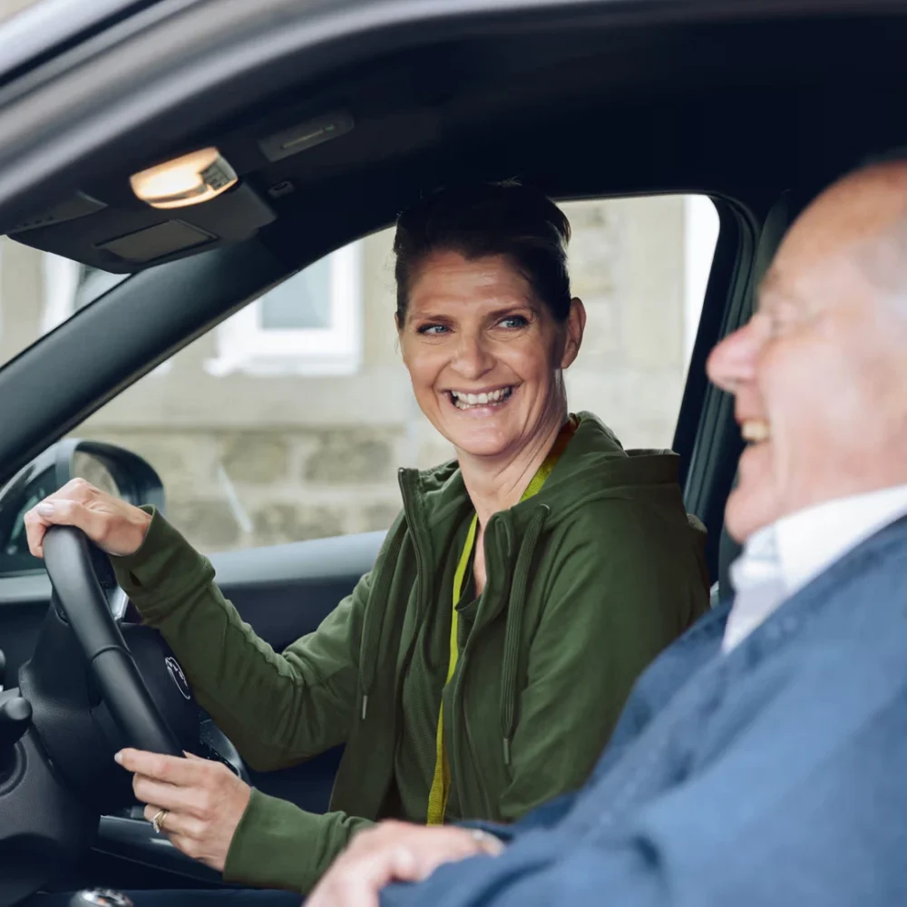 Home Instead Care Professional driving her client
