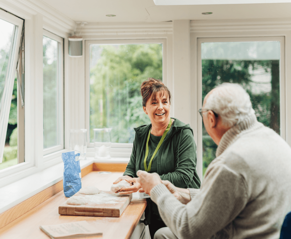 Carer cooking with older adult