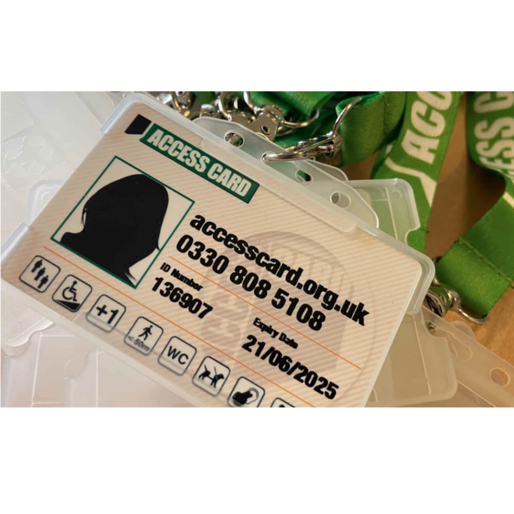 Close-up of an Access Card with contact details, icons for accessibility, and a green lanyard. - Home Instead
