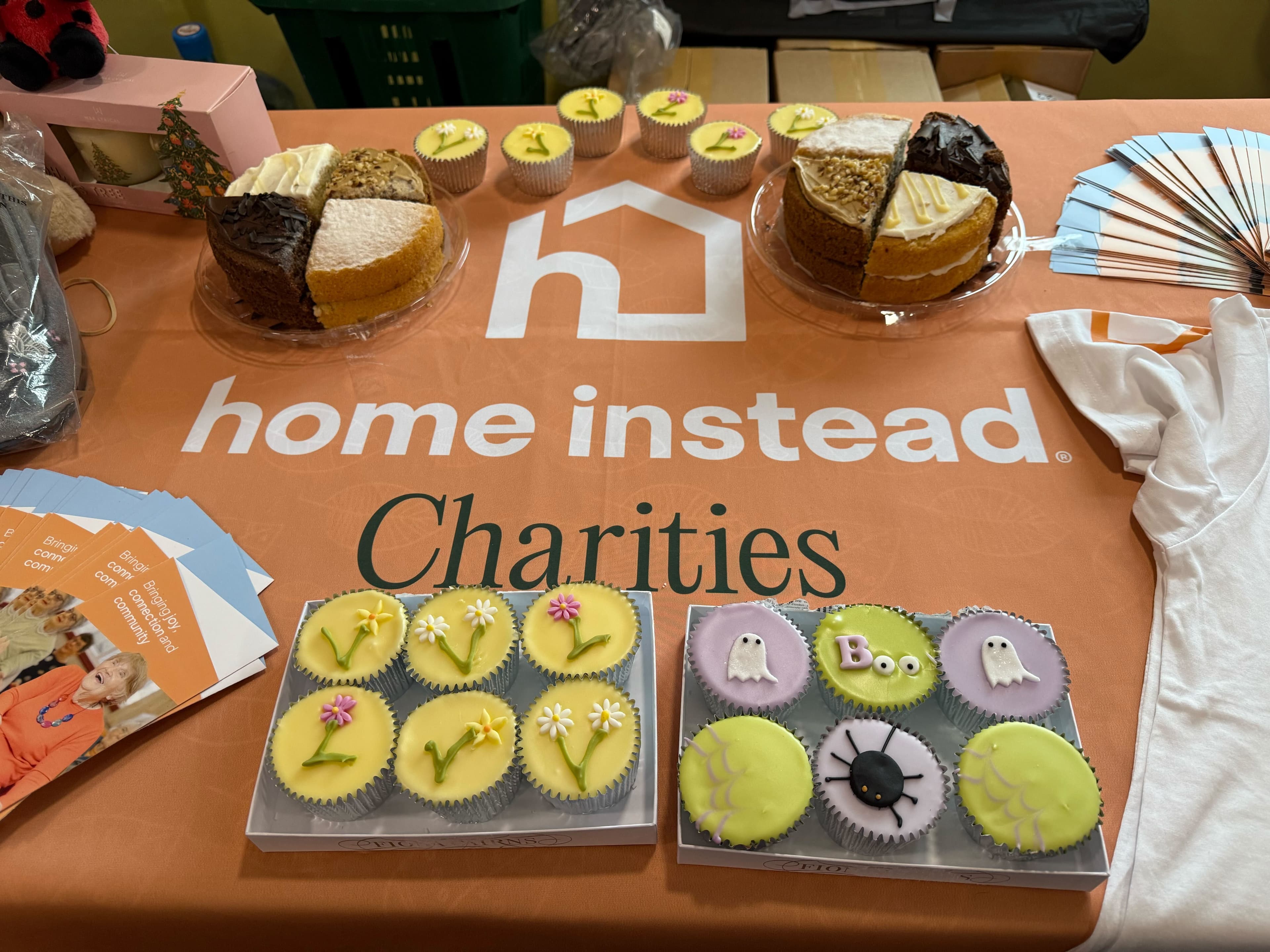Home Instead Charities stall with cakes on