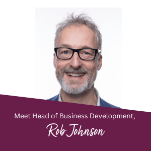 Smiling man with glasses, titled "Head of Business Development, Rob Johnson" on a purple banner at the bottom. - Home Instead