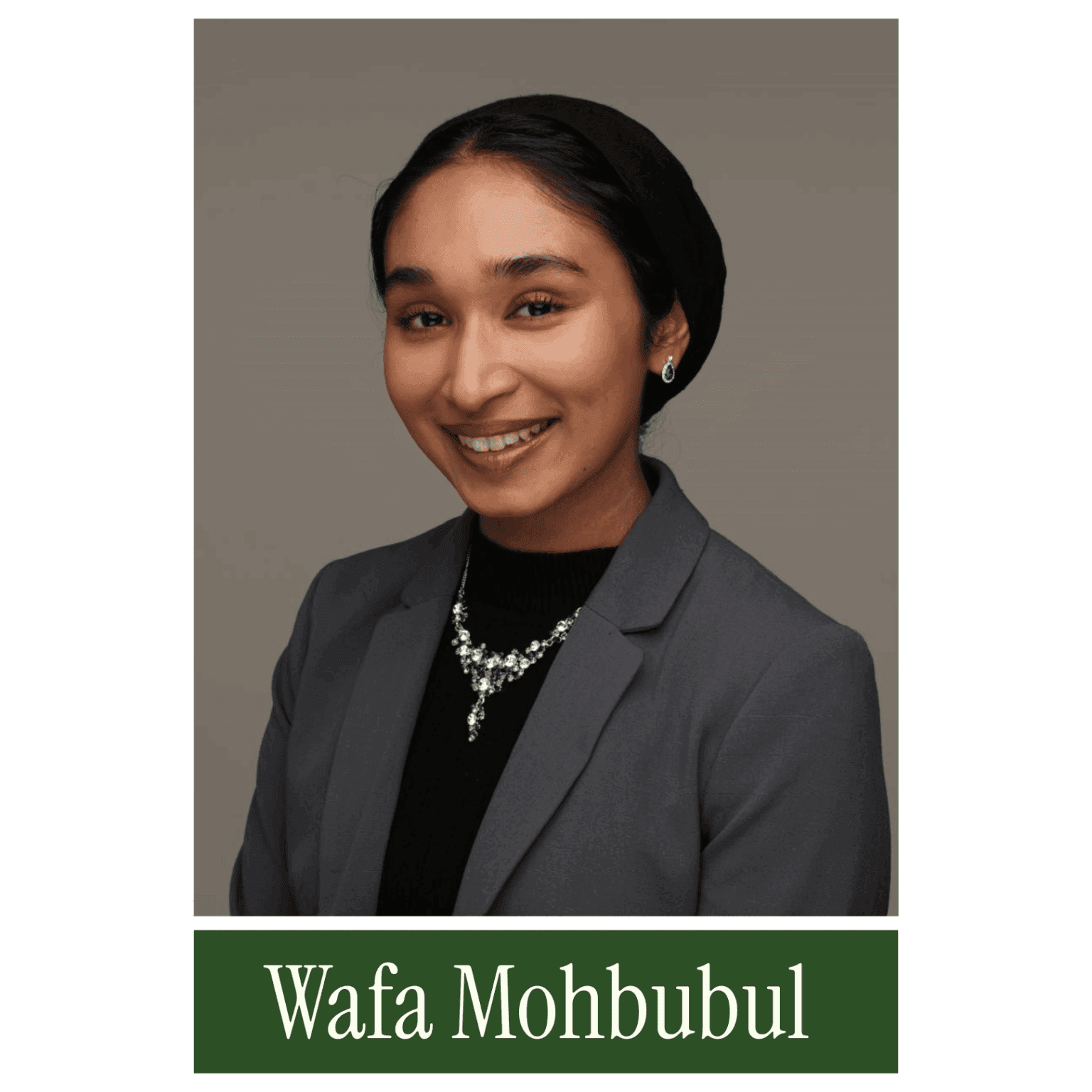 Smiling woman in a grey blazer and black headscarf, with "Wafa Mohbubul" written below. - Home Instead