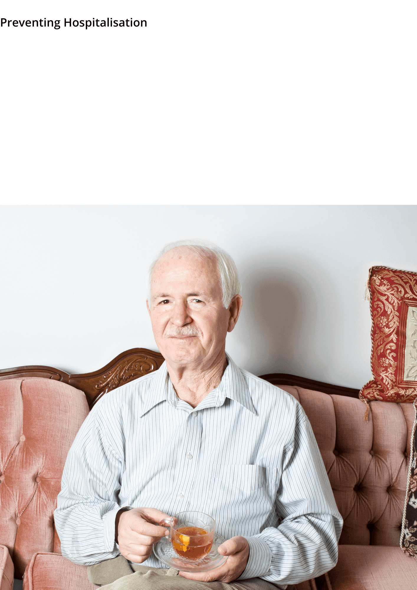 Elderly man sitting on a pink couch, holding a cup of tea and smiling, with "Preventing Hospitalisation" text above. - Home Instead