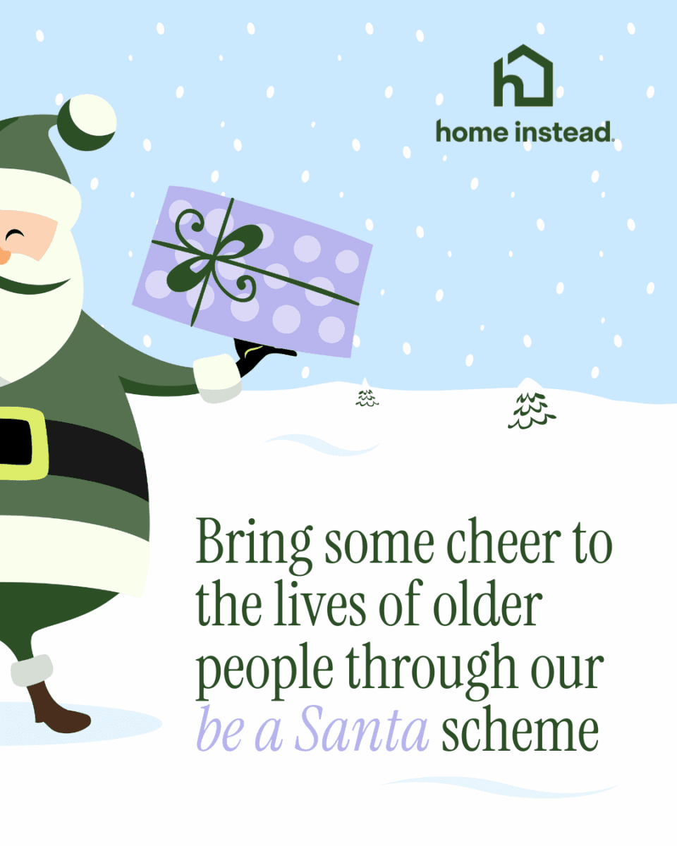 Cartoon Santa holding a gift, with text: "Bring some cheer to older people through our be a Santa scheme. - Home Instead