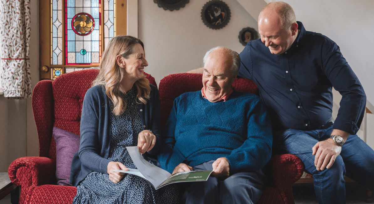 Male client with lady and man laughing and reading