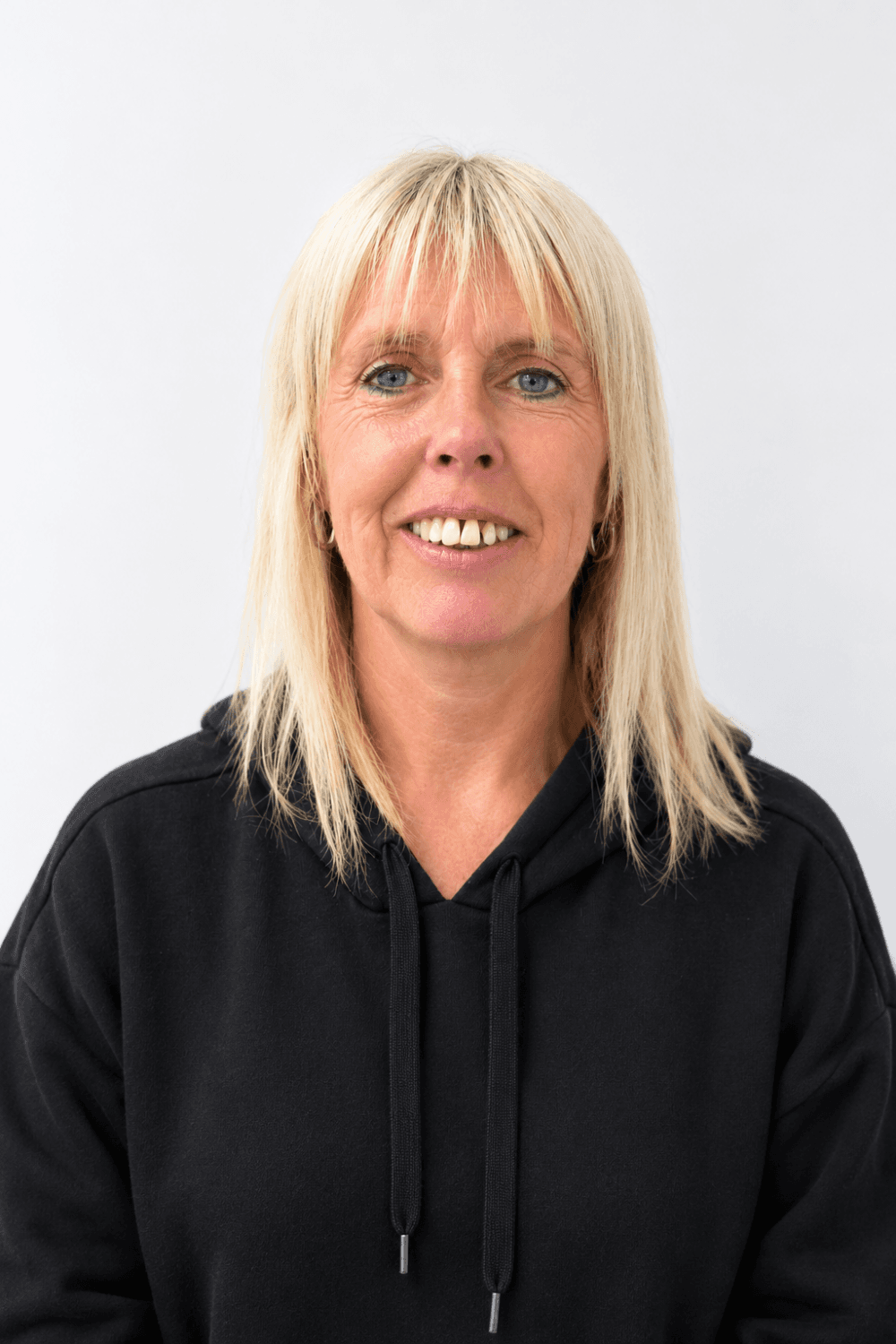 Smiling Woman in Black Hoodie