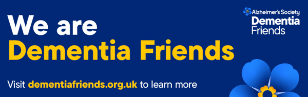 Blue banner reading "We are Dementia Friends", with Alzheimer's Society logo and a blue forget-me-not flower. - Home Instead