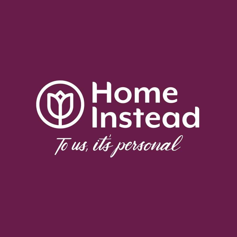 Home Instead logo featuring a tulip outline and the text "Home Instead: To us, it's personal" on a maroon background. - Home Instead