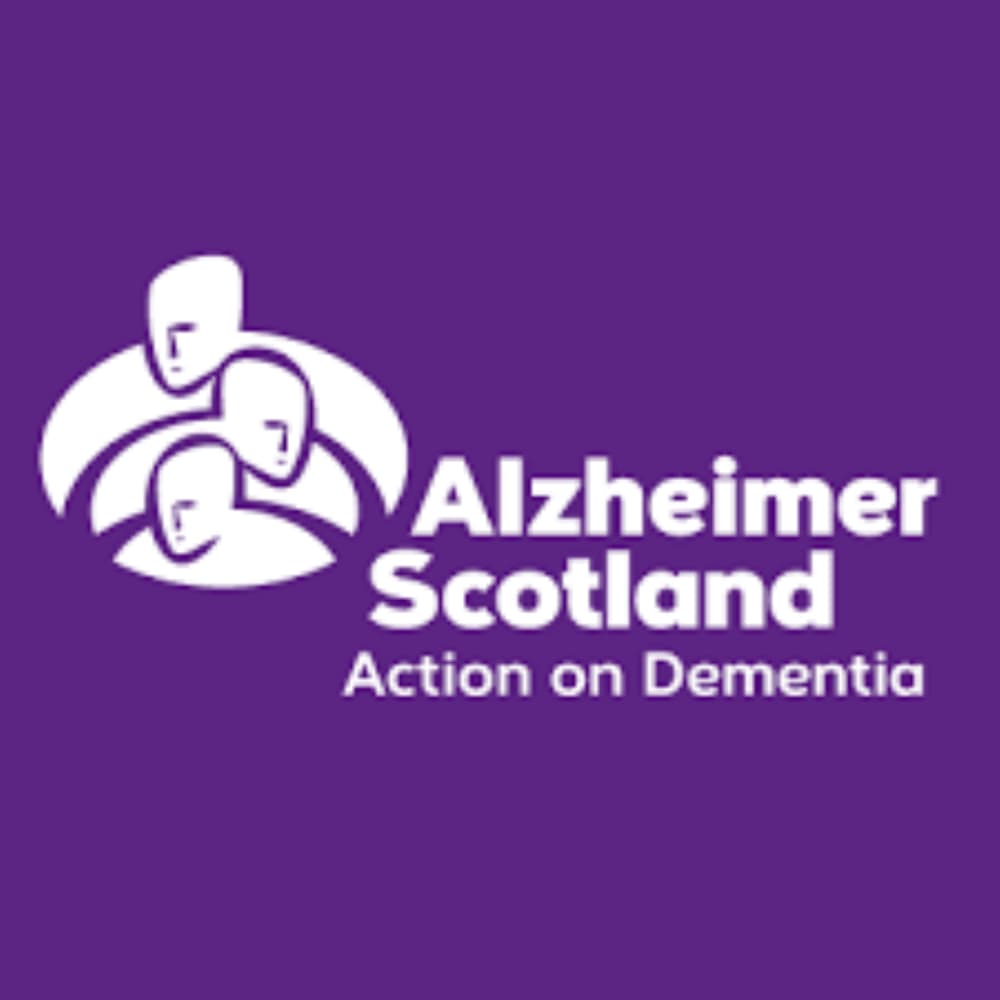 Alzheimer Scotland logo with three abstract human figures, the text reads "Alzheimer Scotland: Action on Dementia" on a purple background. - Home Instead