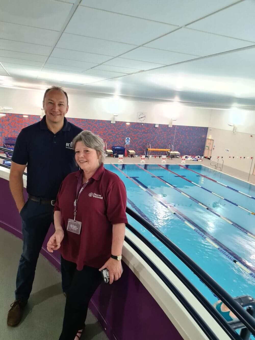 Home Instead Basingstoke picture of Simon Toop with Janet from Home Instead Basingstoke at the swimming pool at Basingstoke Sports Centre