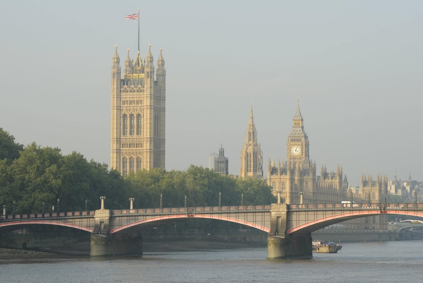 View of Westminster Bridge over the River Thames with the iconic Big Ben and the Palace of Westminster in the background. - Home Instead